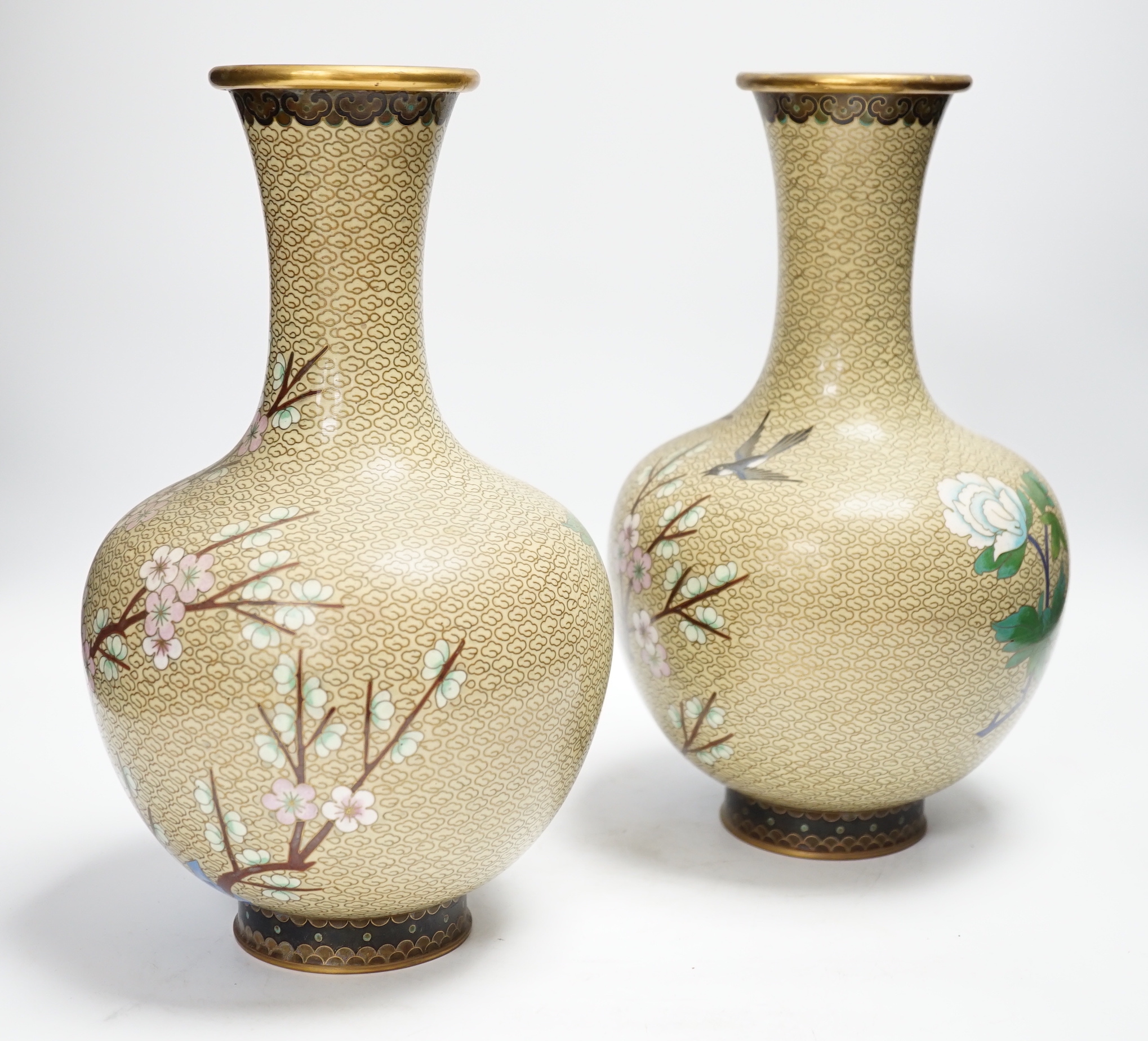 A pair of Chinese cloisonné enamel blossom decorated vases, 30cm high